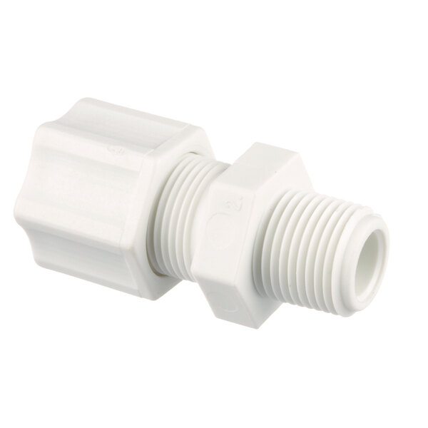 A close-up of a white plastic pipe fitting.