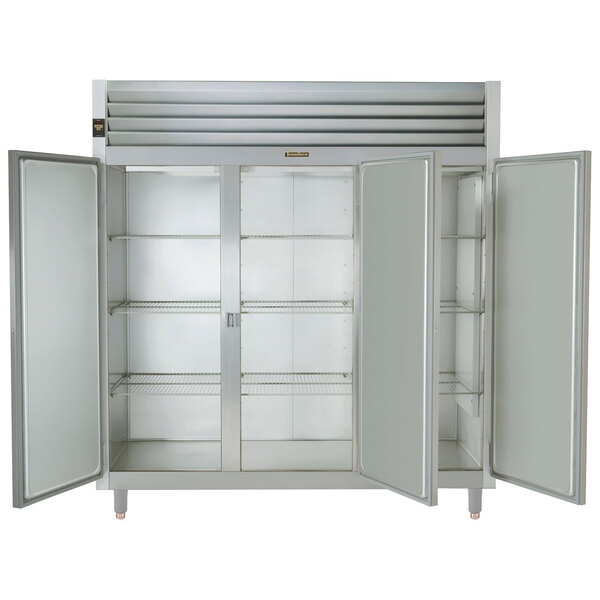 A Traulsen narrow reach-in refrigerator with three open white doors.