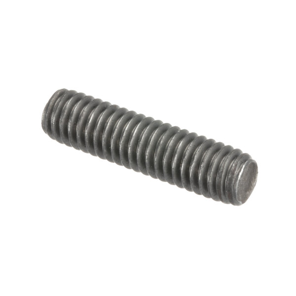 A close-up of a bolt with a long screw on a table.