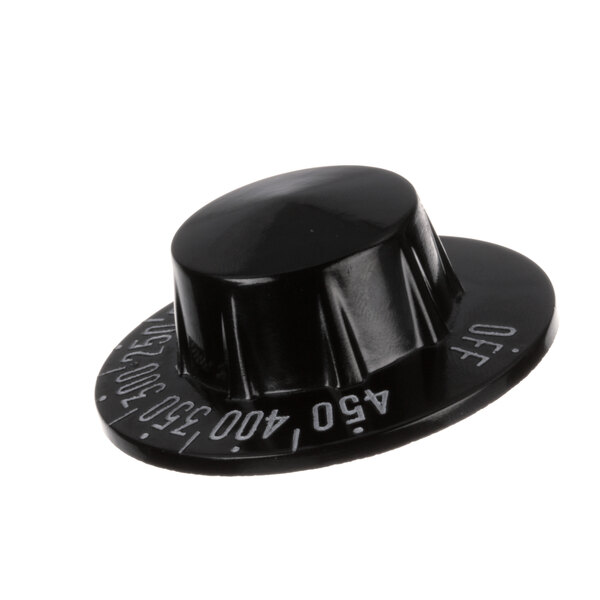 A black plastic Groen thermostat knob with white text and numbers.
