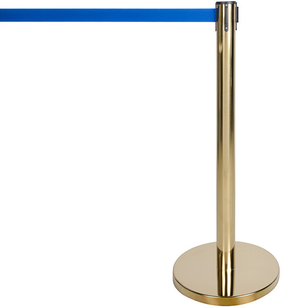 A gold Aarco crowd control stanchion with a blue retractable belt.