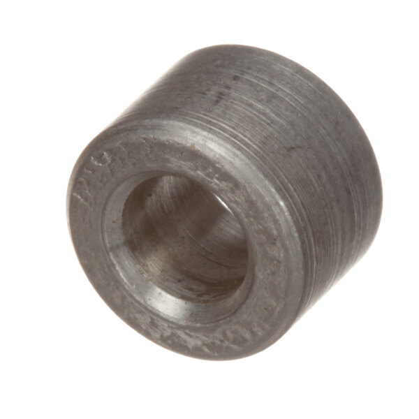 A round metal Cres Cor bushing with a hole in the center.
