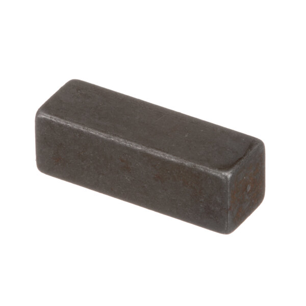 A black rectangular metal Hobart mixer key.