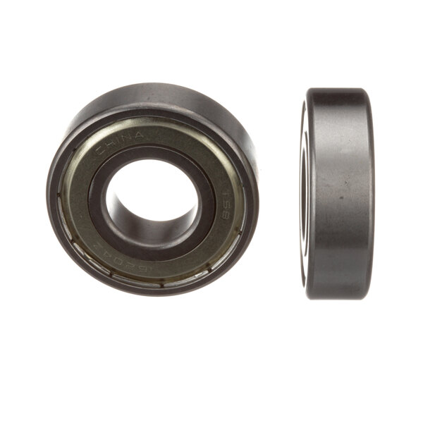 A close-up of two Alliance Laundry ball bearings.
