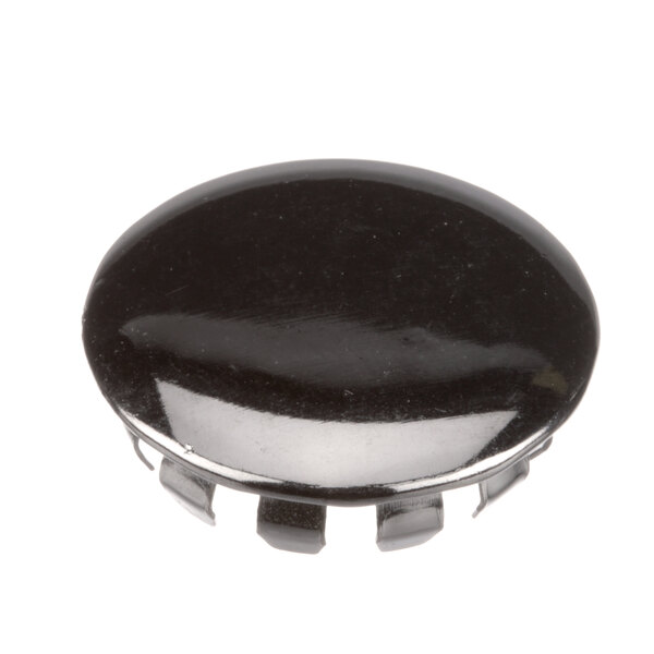 A black Master-Bilt plug button with holes.