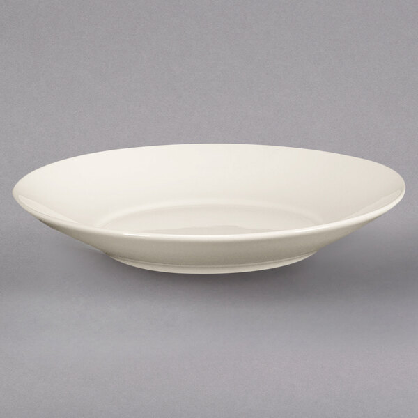 A Homer Laughlin ivory bowl on a white background.