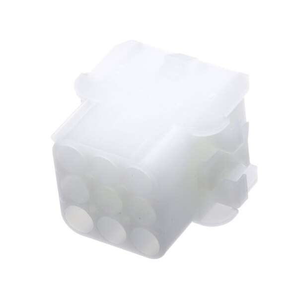 A white plastic Frymaster connector with four holes.