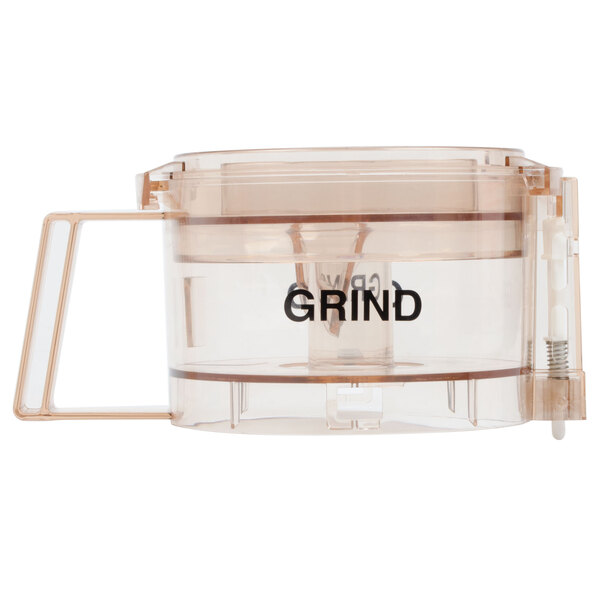A clear plastic Waring grinding bowl with a black handle and clear lid.