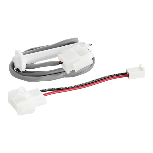 A close-up of a Scotsman water level sensor wire harness with white and red wires.