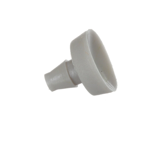 A close-up of a white plastic knob.