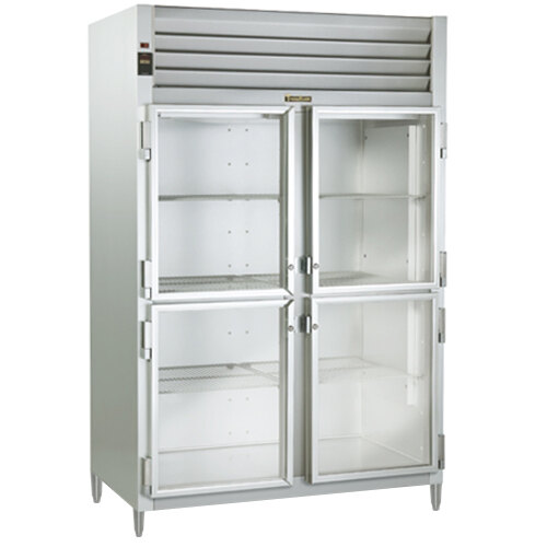 A white Traulsen shallow depth reach-in refrigerator with glass doors on a metal frame shelf.