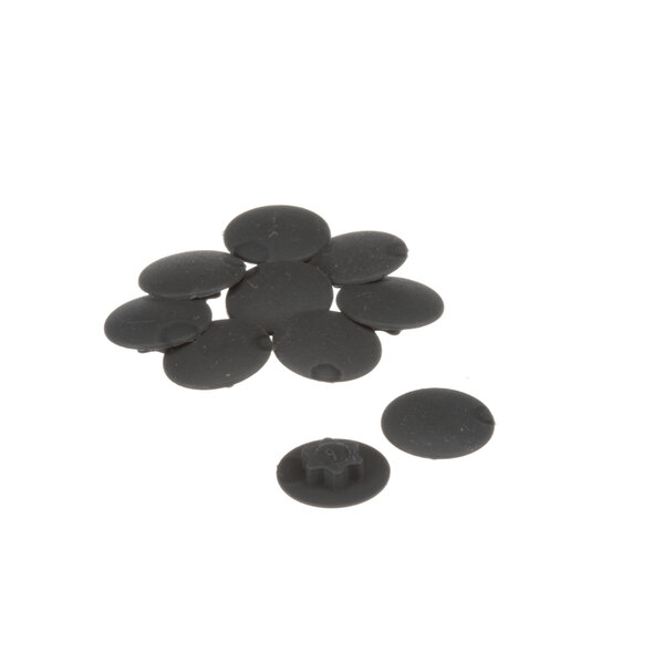 A group of black round Rational caps with a white circle in the middle.