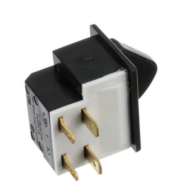 A black and white electrical switch with two gold pins.