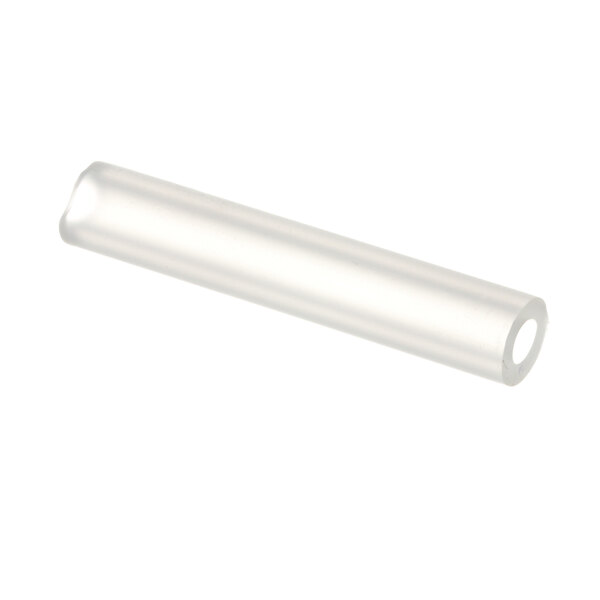 A clear plastic tube with a white circle on the end