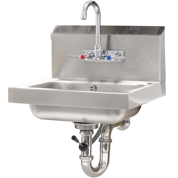 A stainless steel Advance Tabco hand sink with a splash mount faucet and lever operated drain.