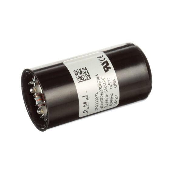 A black round capacitor with a white label.