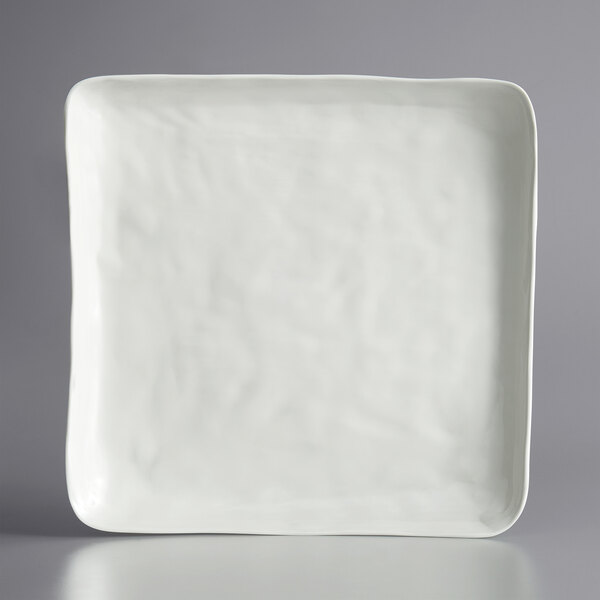 A white square melamine platter with a white border.
