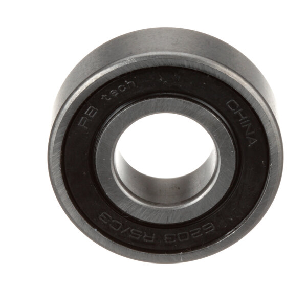 A close-up of a black and white Univex bearing.