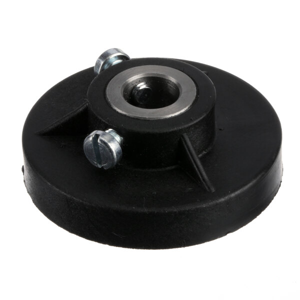 A black plastic disc with a metal nut on it for a Berkel Cam.