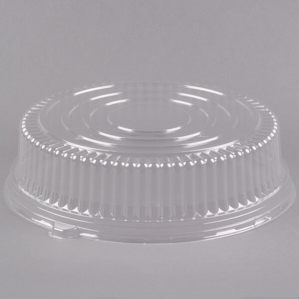 A Fineline clear plastic dome lid with a circular rim on a clear plastic container.