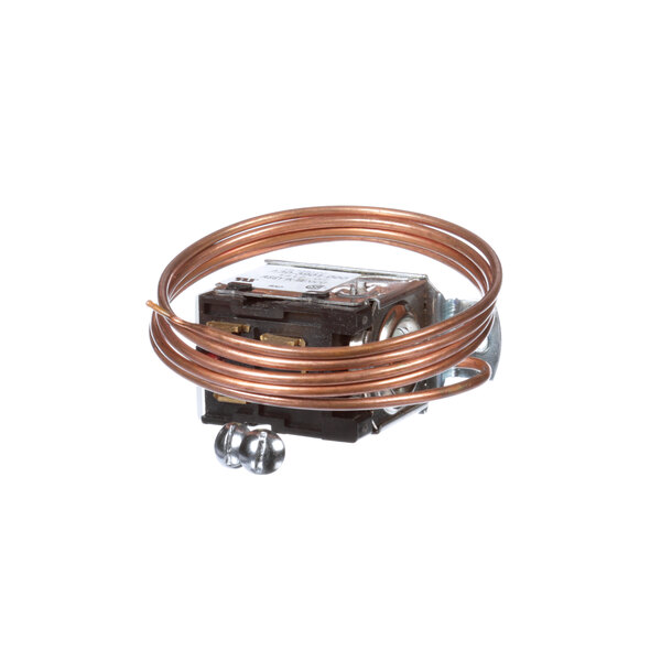 A close-up of a copper coil thermostat.