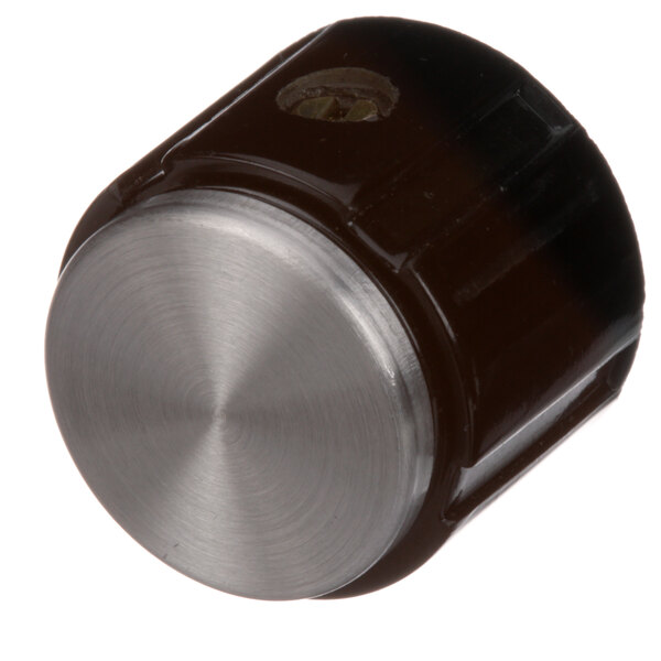A close-up of a black and silver metal knob.