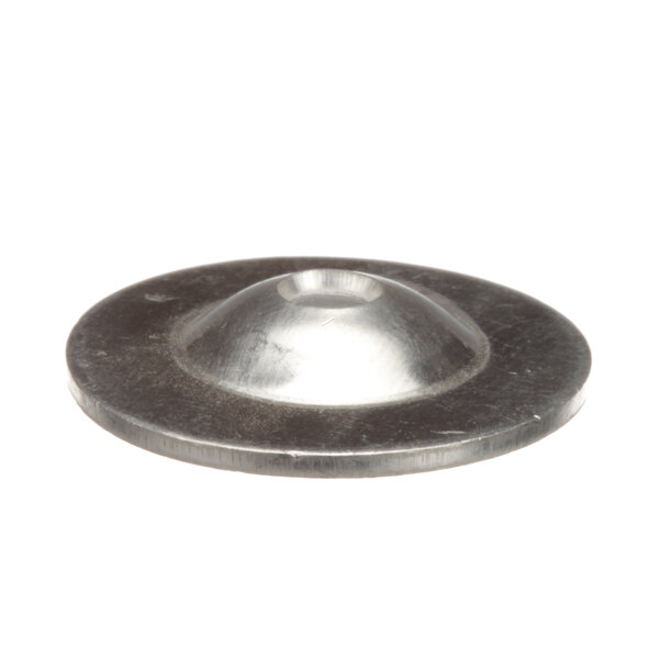 A close-up of an Accutemp round metal washer with a hole in the middle.