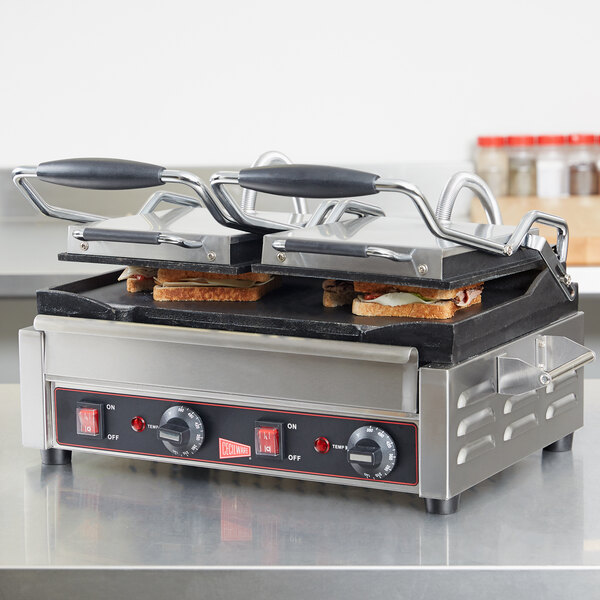 A Cecilware double panini sandwich grill with two sandwiches on it.
