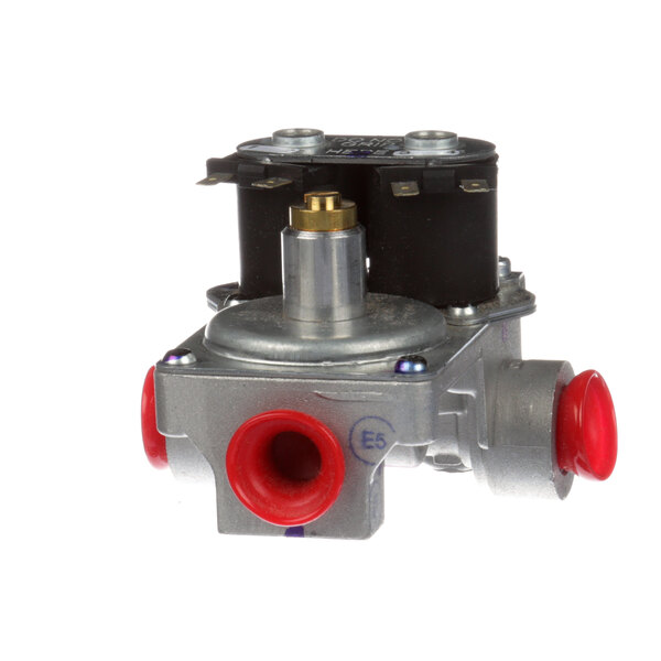 A close-up of a Garland natural gas control regulator with two red valves on it.