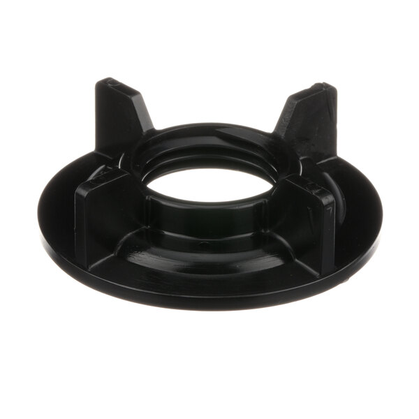 A black plastic Perlick nut with a hole in it.