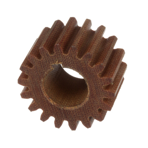 A close-up of a brown Groen gear with a hole in the center.