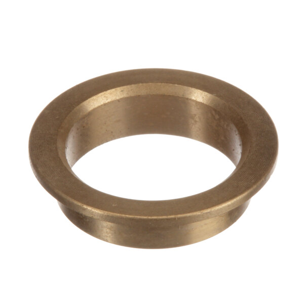 A close-up of a brass ring with a hole in it.