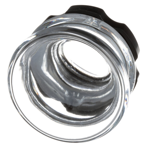 A clear glass container with a black rubber cap.