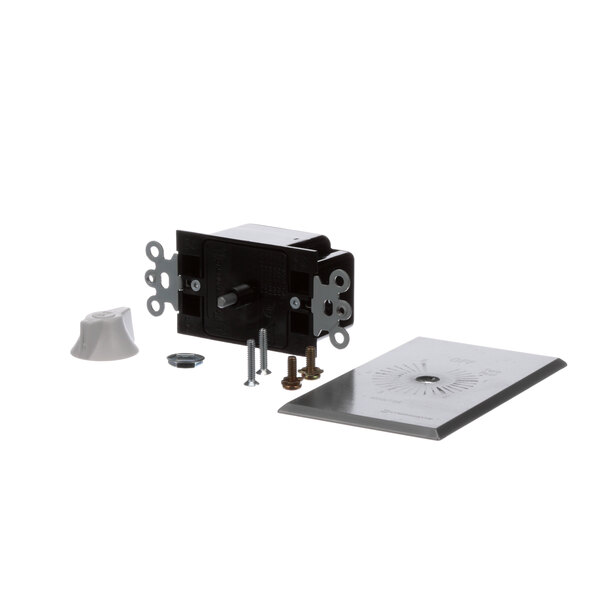 A black rectangular electrical box with a silver metal plate and screws.