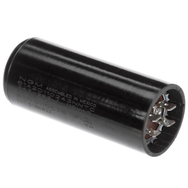 A black cylindrical Cornelius capacitor with white text.