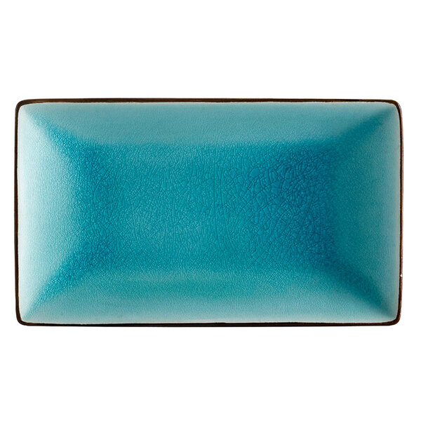 A blue rectangular Japanese style stoneware plate with a brown border.