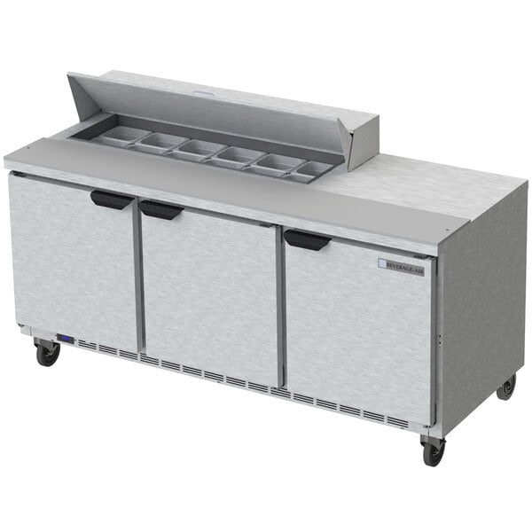 A Beverage-Air stainless steel 3 door refrigerated sandwich prep table.