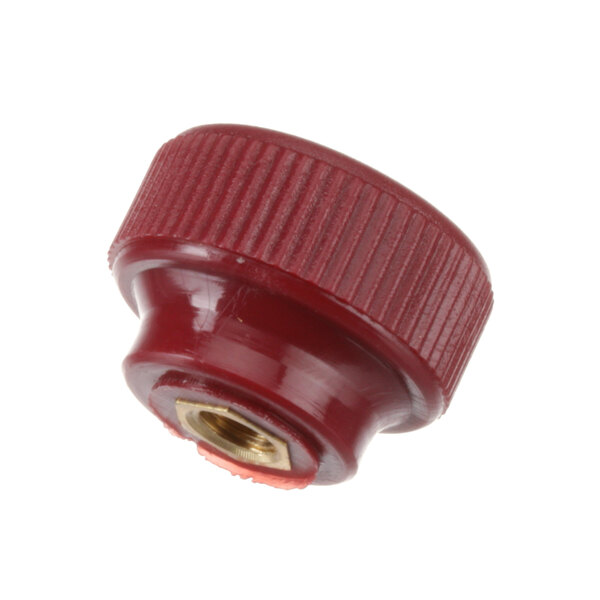 A red plastic knob with a metal nut.