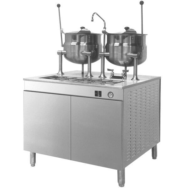 A Cleveland Electric Tilting steam kettle with 2 pots on top.