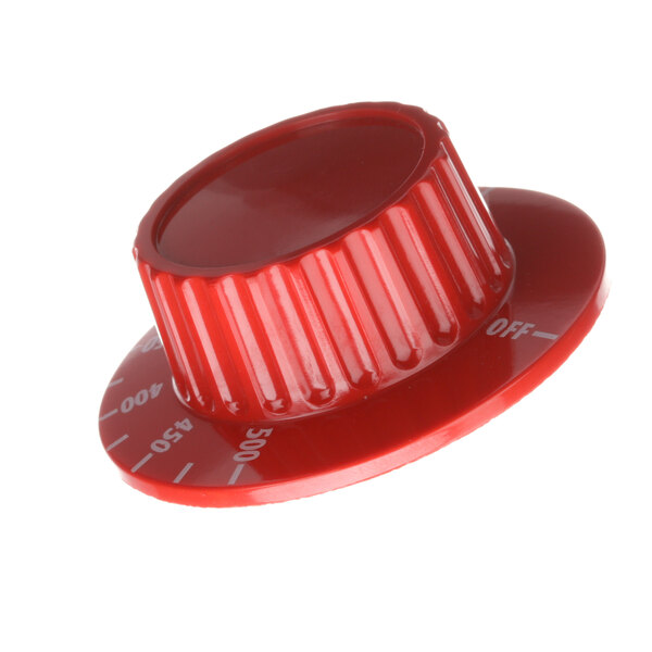 A close-up of a red plastic knob with white numbers.