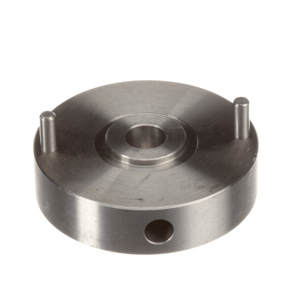 A round metal Cleveland Hub Assembly with two holes in it.