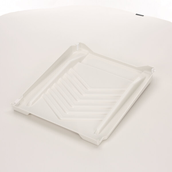 A white plastic Manitowoc Ice water curtain tray.