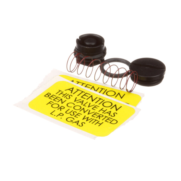 A Legion LP gas valve connection kit with black rubber seals and a yellow label.