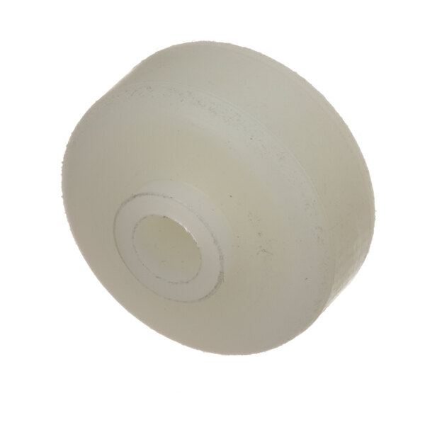 A white plastic Cleveland wheel with a hole in the center.