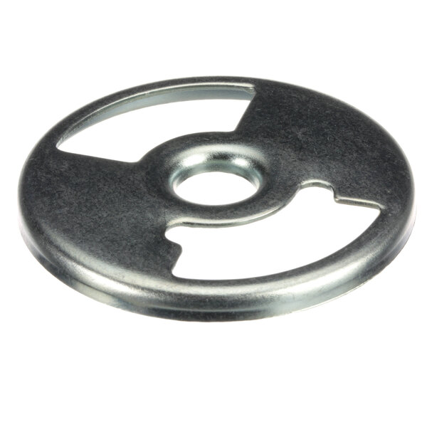 A close-up of a Montague air shutter, a metal circle with a hole in the center.