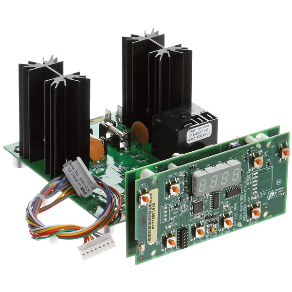 A green circuit board with black and white rectangular objects.