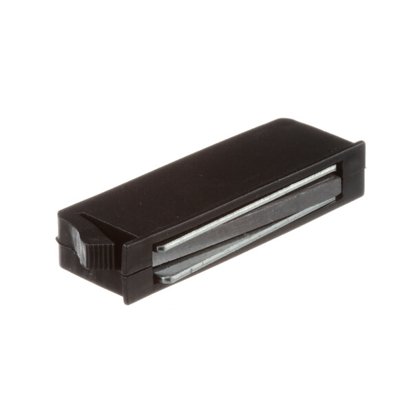 A black rectangular object with a metal strip.