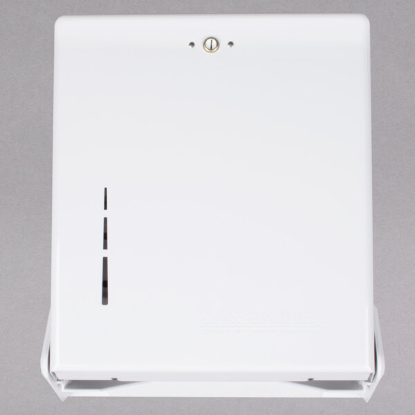 A white rectangular San Jamar C-Fold / Multi-Fold towel dispenser with a button and a hole.