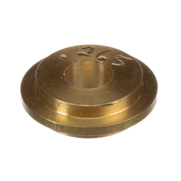 A close-up of a brass Cleveland gas orifice with a hole in it.