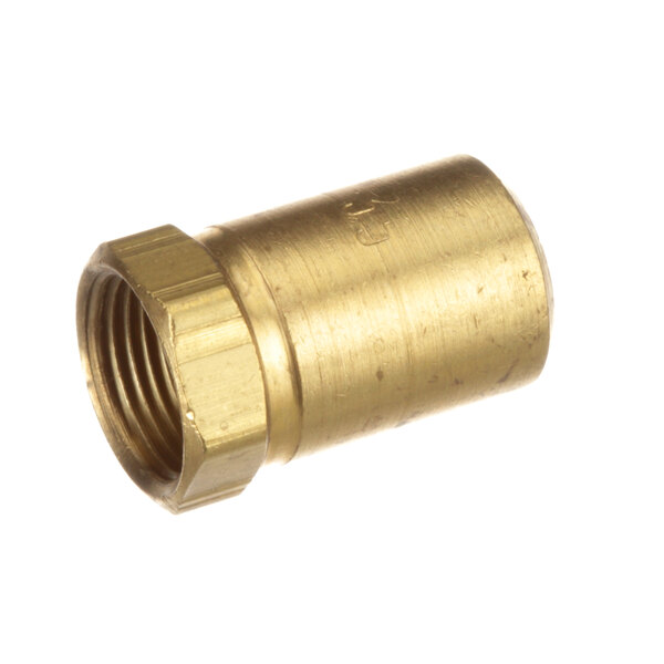 A brass nut on a gold metal pipe.